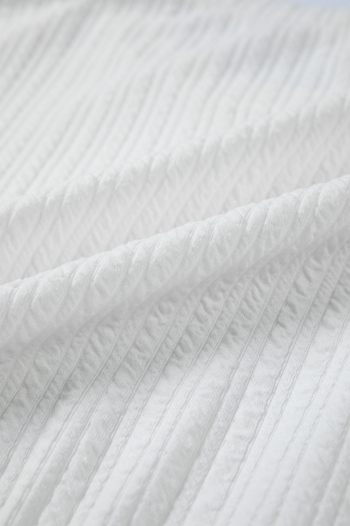 Solid Textured Drop Shoulder Peplum Top