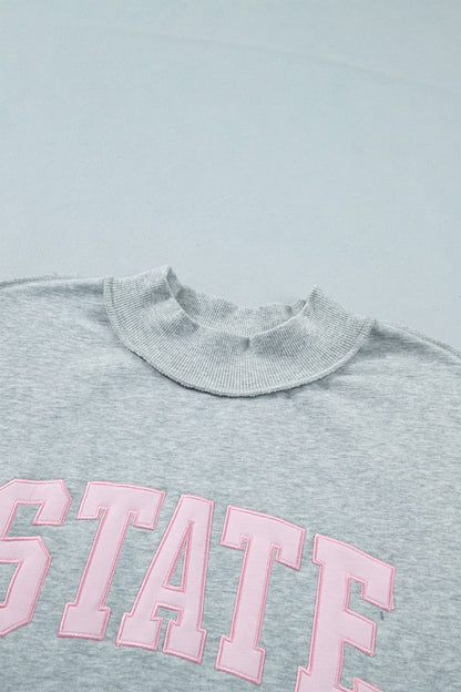 STATE Embroidered Exposed Seam Mock Neck Sweatshirt