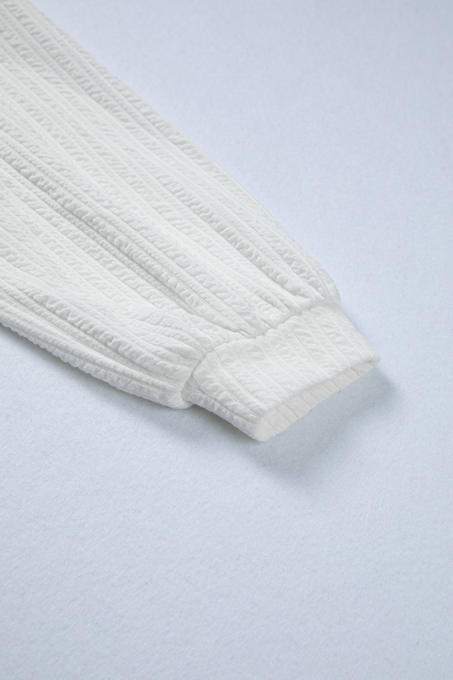 Solid Textured Drop Shoulder Peplum Top