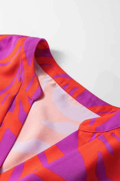 Abstract V-Neck Cuffed Short Sleeve Blouse