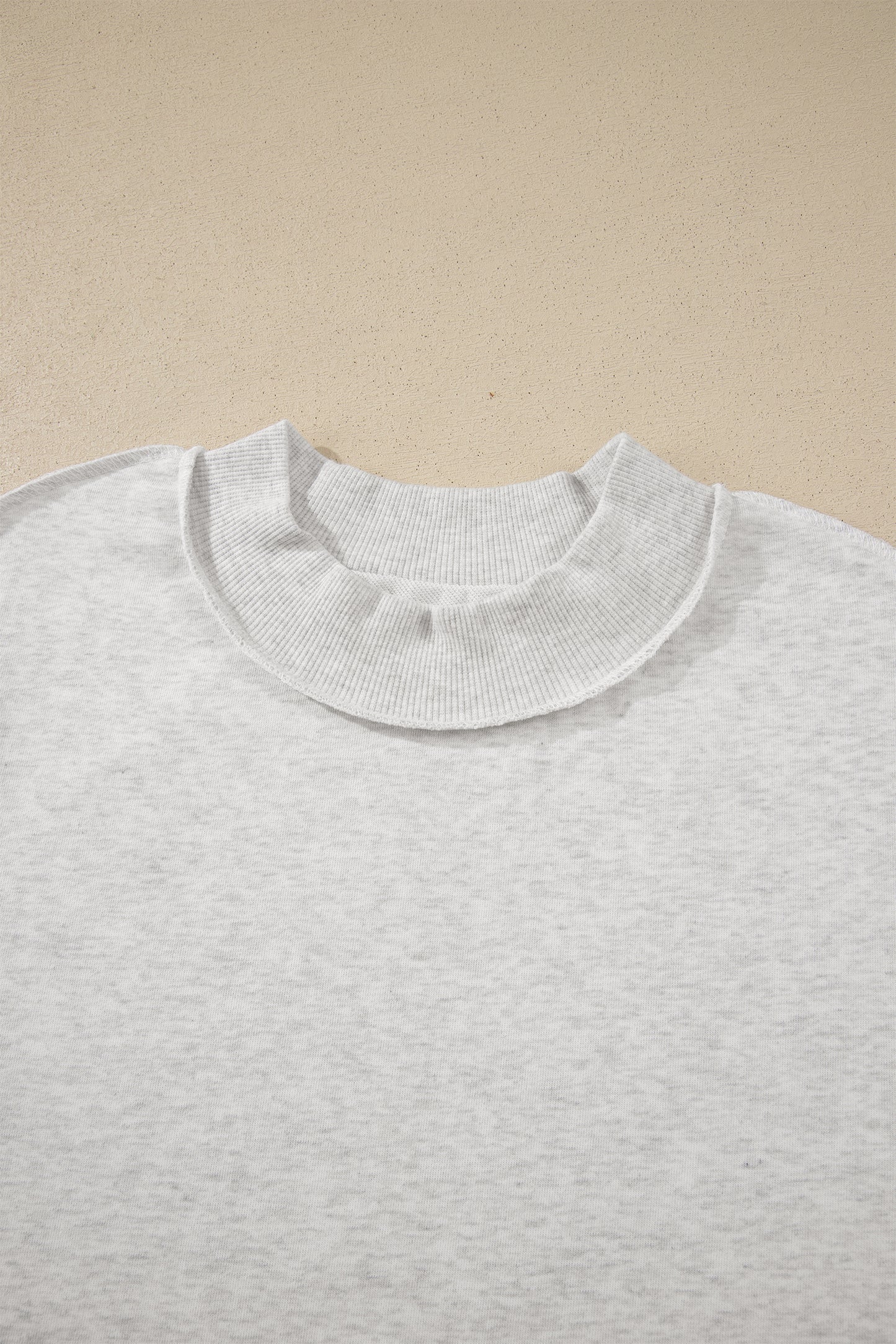 Solid Exposed Seam Mock Neck Tee