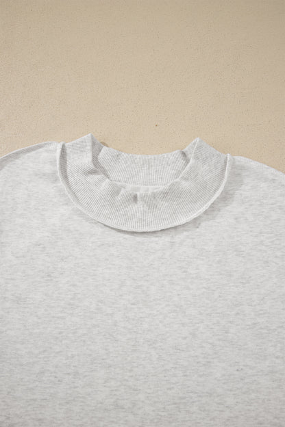 Solid Exposed Seam Mock Neck Tee