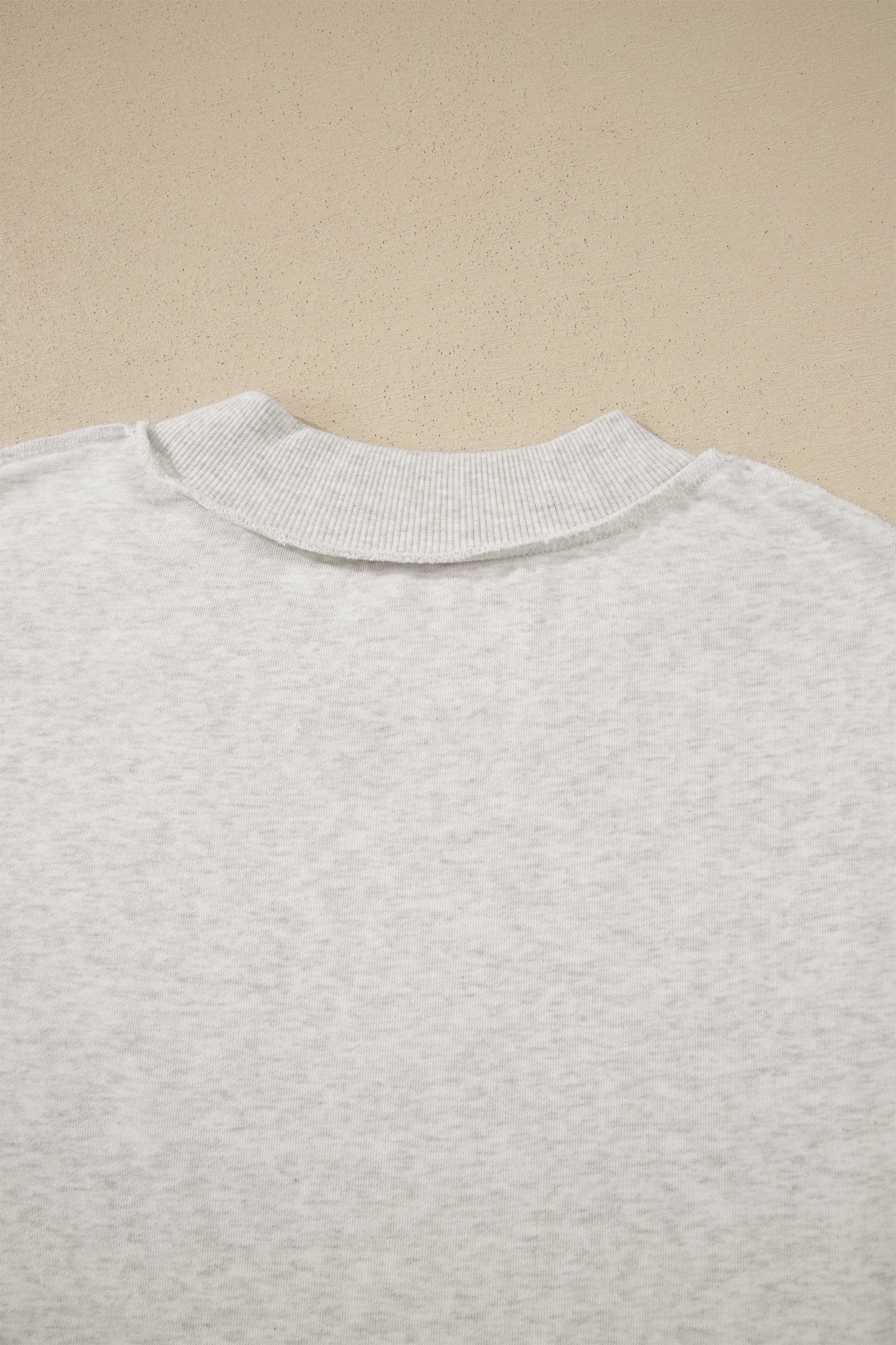 Solid Exposed Seam Mock Neck Tee